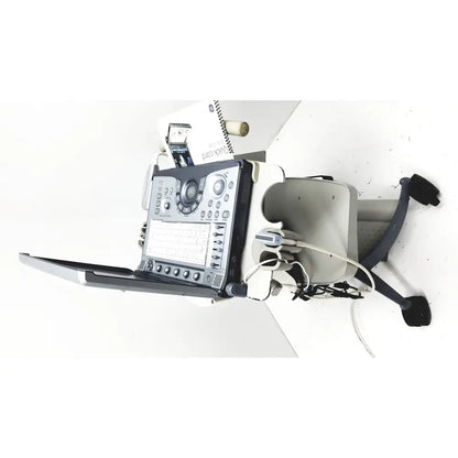 Ge logiq e portable ultrasound machine with black and silver control panel on wheeled cart portable ultrasound device