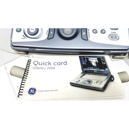 Silver and black ge logiq e portable ultrasound machine with compact design and screen showing image untested model