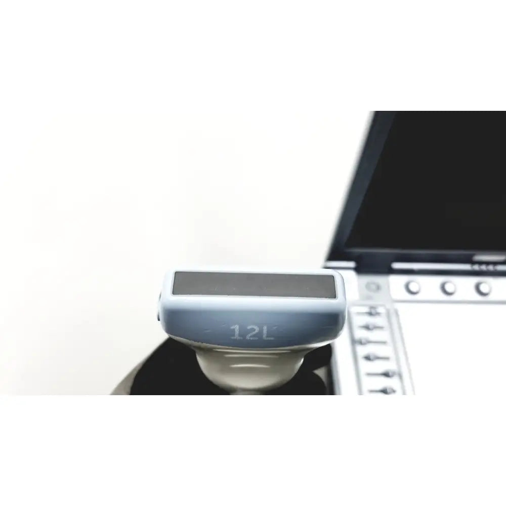 Light blue plastic logiq e portable ultrasound machine with black screen and 12l engraving on the side untested