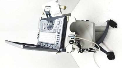 Ge logiq e portable ultrasound machine with black and silver control panel on wheeled cart portable ultrasound device