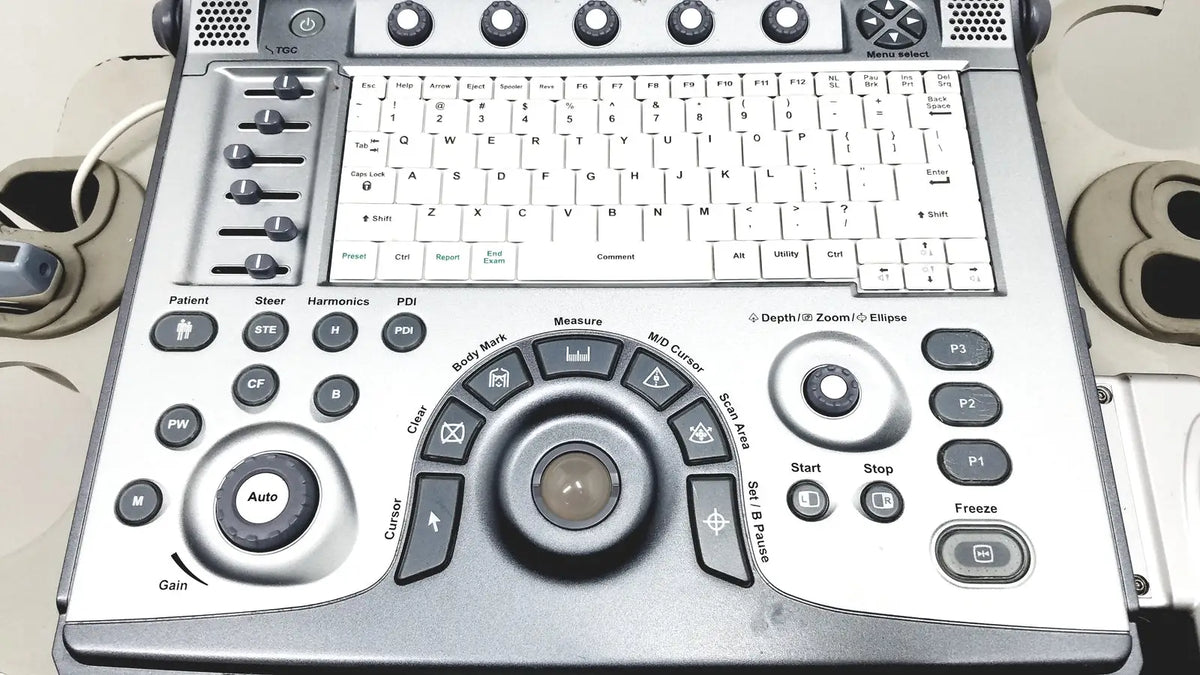 Silver-colored GE logiq e portable ultrasound machine console with built-in keyboard and multiple control buttons