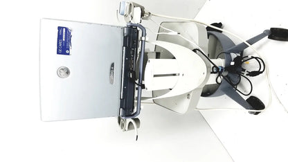 White and gray medical examination chair with adjustable armrests and mounted monitor for logiq e portable ultrasound machine