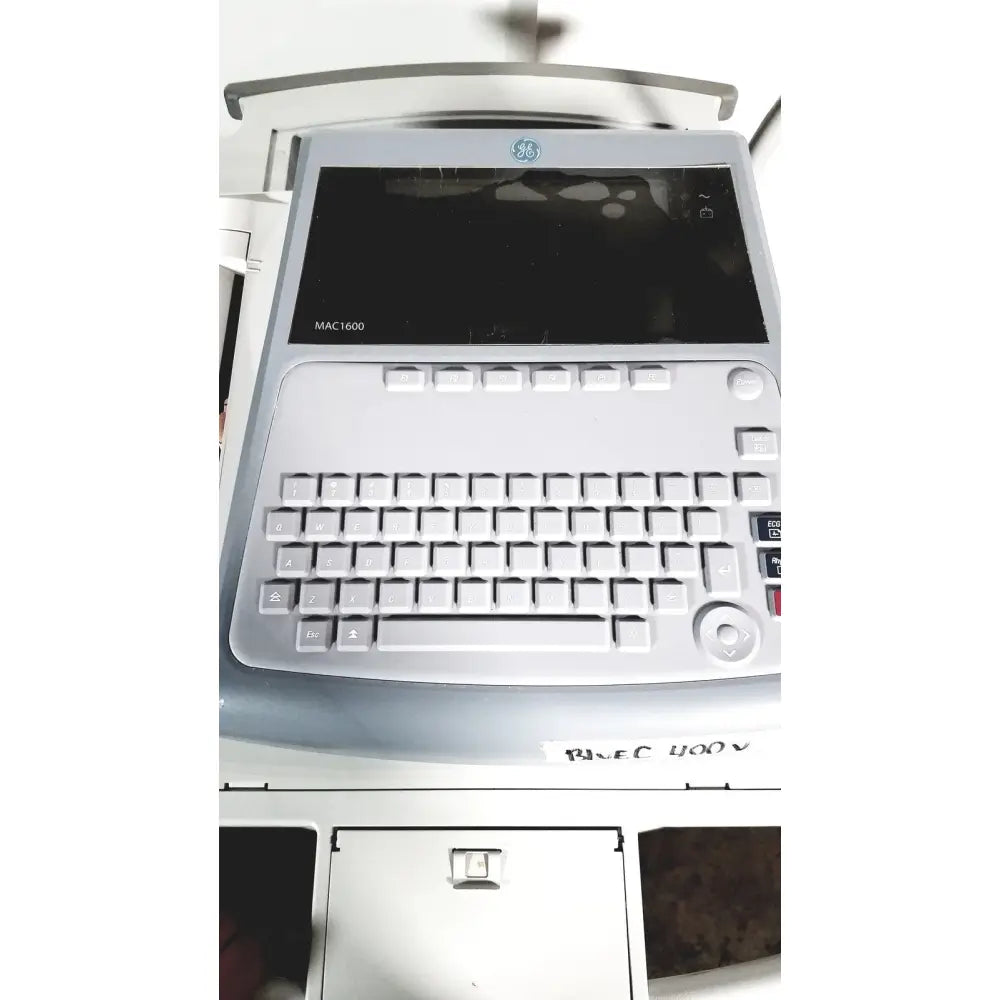 Ge mac 1600 ekg ecg analysis system with sleek silver and gray design featuring integrated keyboard and touchscreen display