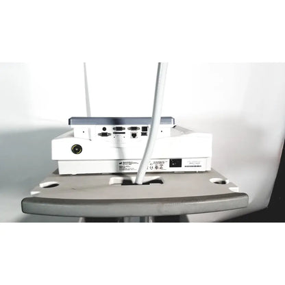 White GE MAC 1600 ekg ecg analysis system back view with gray accents and multiple ports for lead resting patient use