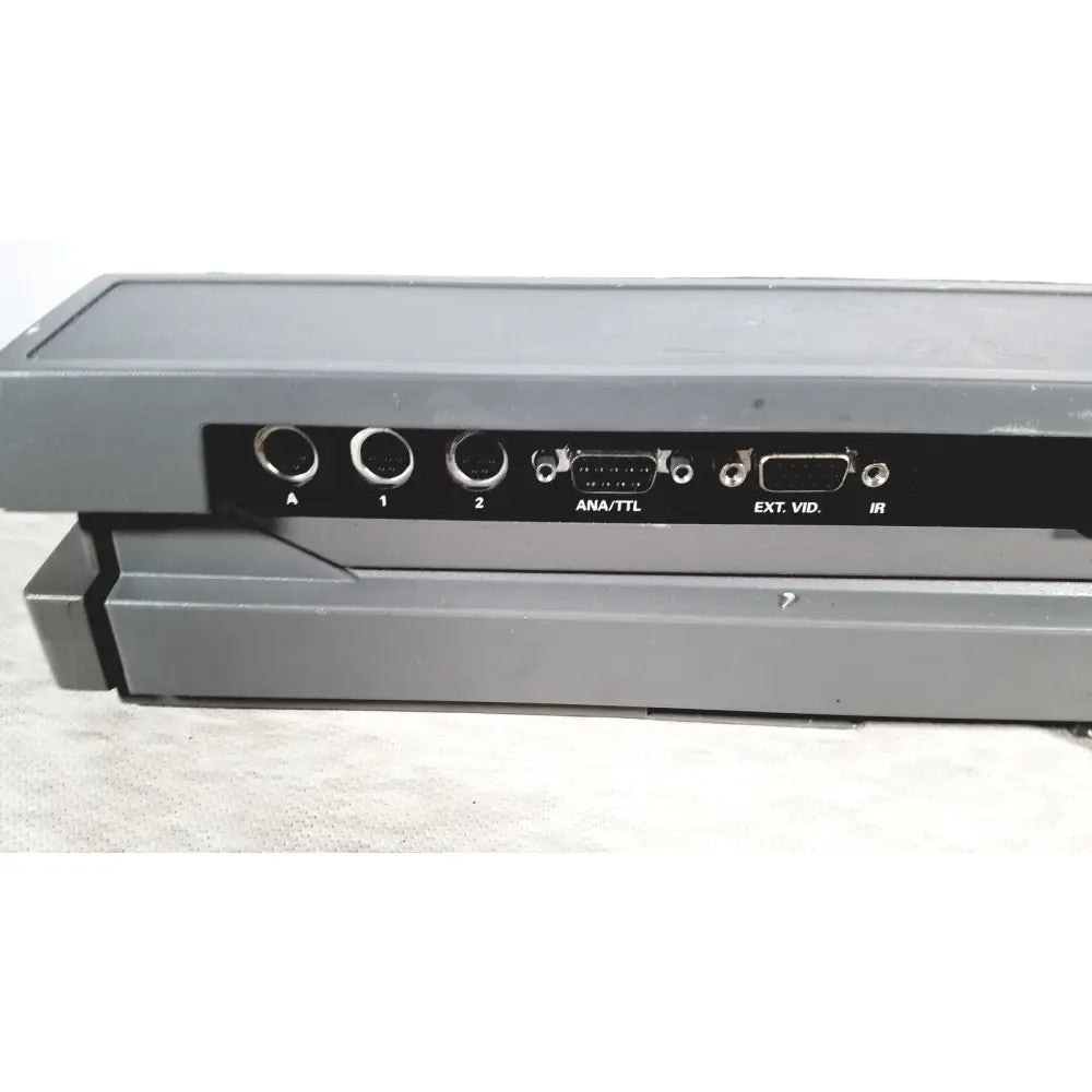 Back side of gray plastic ge mac 5500 hd resting electrocardiogram ecg machine with black panel and labeled ports for reuse medical