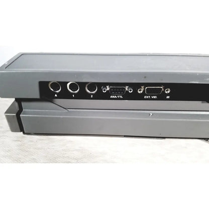Back side of gray plastic ge mac 5500 hd resting electrocardiogram ecg machine with black panel and labeled ports for reuse medical