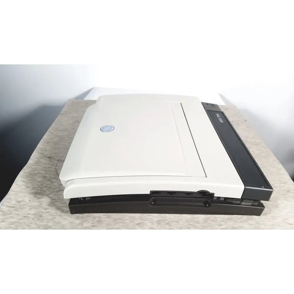 Ge mac 5500 hd resting electrocardiogram ecg machine with a beige and black pavilion laptop and color display