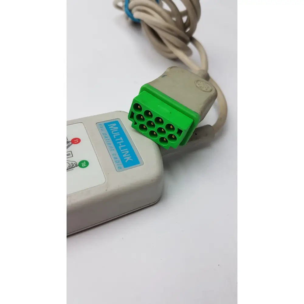 Gray and green marquette multilink esu patient cable connector with beige leadwire for esu patient cable use