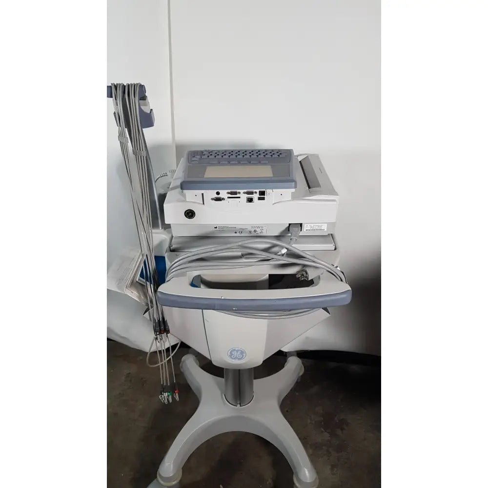 Gray and white ge medical mac1600 ecg analysis system with keyboard screen multiple cables on cart stand for medical use