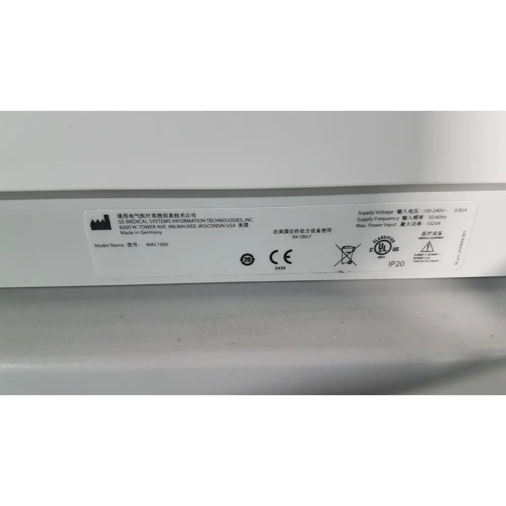 White rectangular label on the back of a medical mac1600 ecg device showing model mac1500 specifications and symbols