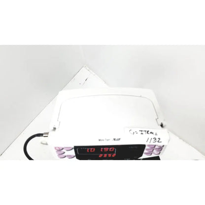 White plastic ge medical mini torr plus patient monitor ref 3444 with digital display and purple buttons on rolling stand