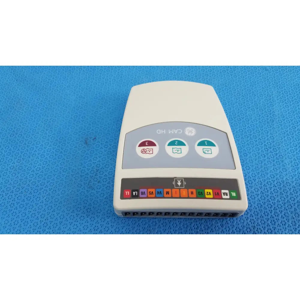 Cream-colored ge medical system cam hd 900995-003 ecg acquisition module showing back side with buttons and labeled ports for reuse medical use