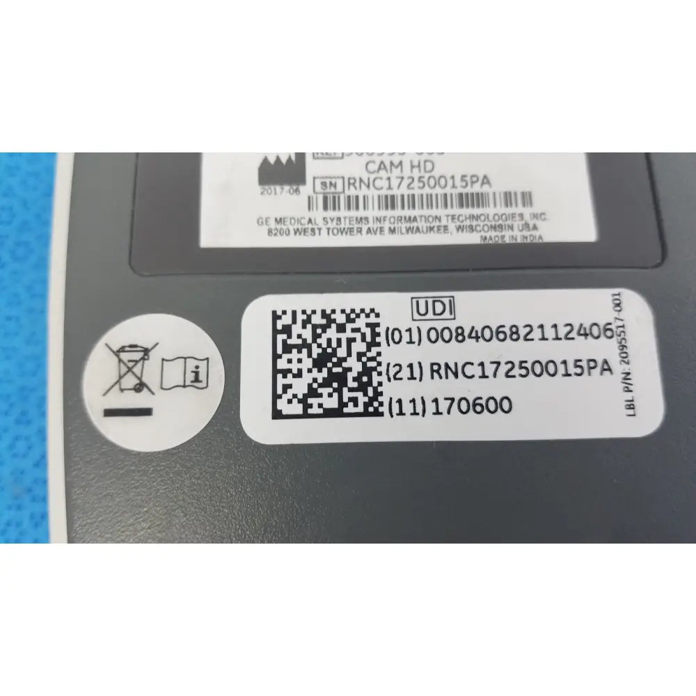 Gray plastic GE Medical System CAM HD 900995-003 ECG acquisition module with white labeling and QR code on the back side