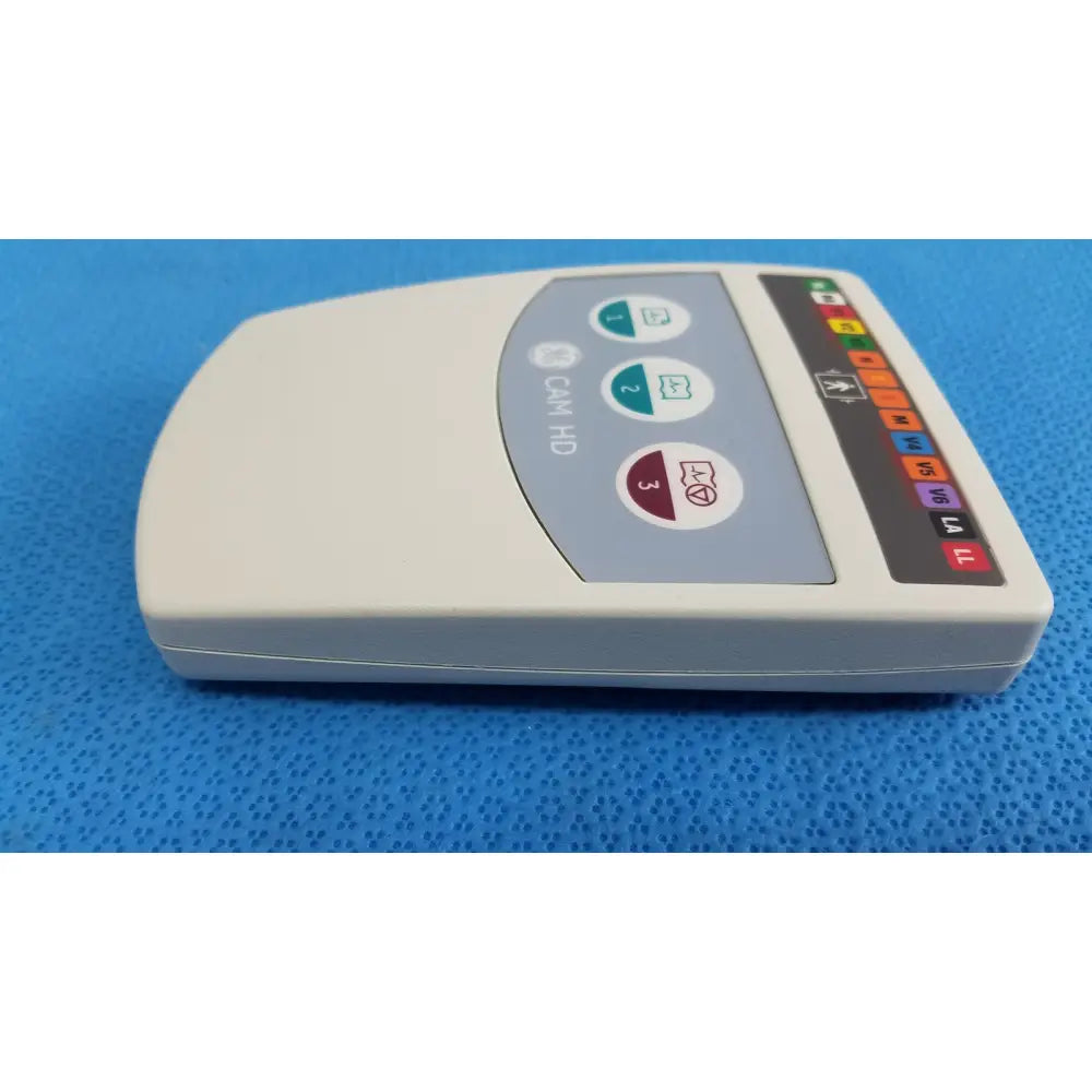 Cream-colored GE medical system CAM HD 900995-003 ECG acquisition module with curved top and colorful electrode indicators