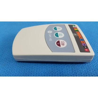 Cream-colored GE medical system CAM HD 900995-003 ECG acquisition module with curved top and colorful electrode indicators