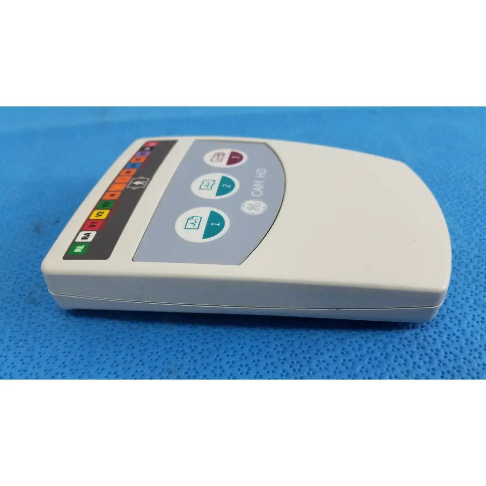 Cream-colored ge medical system cam hd 900995-003 ecg acquisition module with gray panel and colored indicator lights for reuse medical use