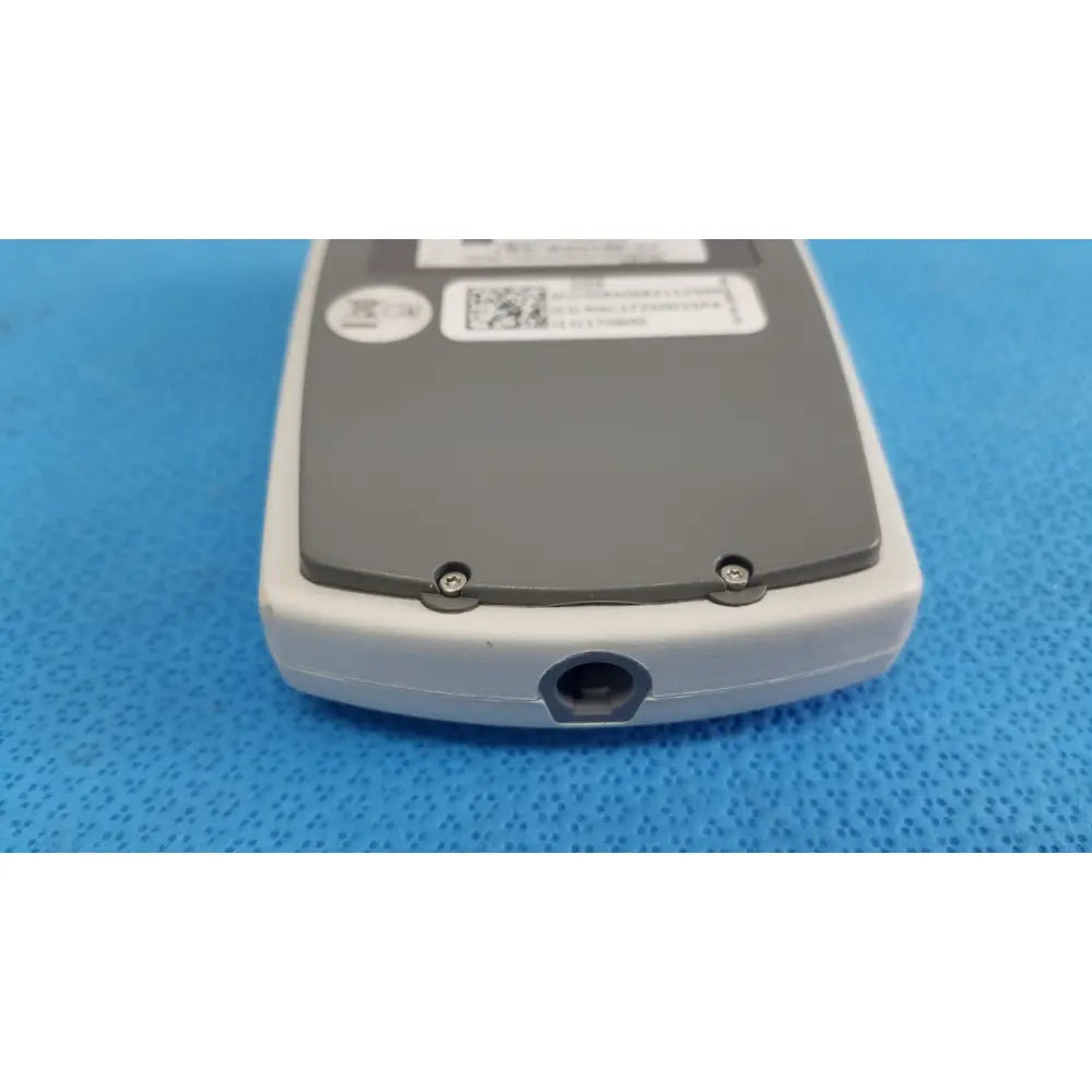 Back side of gray and white matte finish ge medical system cam hd 900995-003 ecg acquisition module with circular port