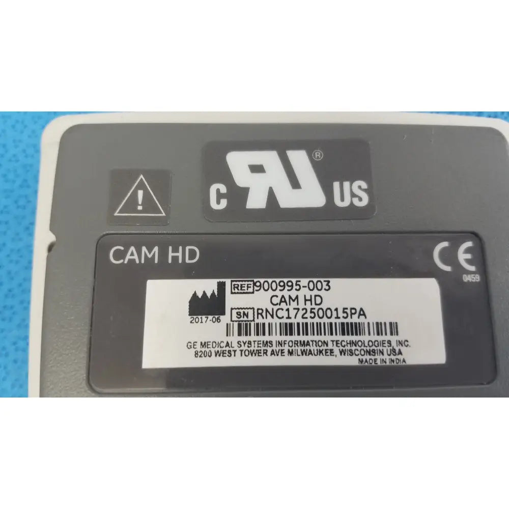 Gray rectangular ge medical system cam hd ecg acquisition module with white serial number sticker on the back side