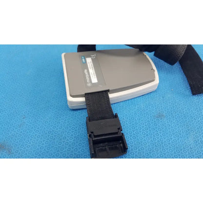 Gray and white marquette e201 luggage tag with black strap designed for ge medical system marquette cam-14 acquisition module