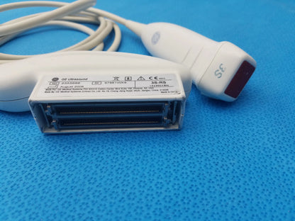 White GE Medical Systems 3S-RS ultrasound transducer probe with red-tipped probe and rectangular connector housing for ultrasound imaging