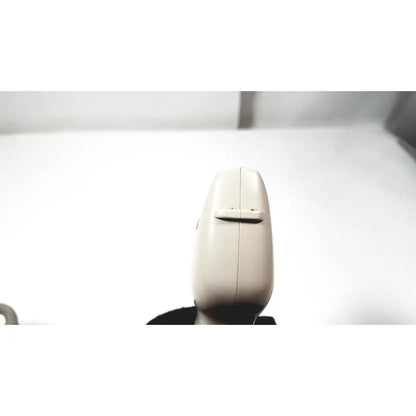 Beige plastic handheld ge medical systems ultrasound convex array transducer with central button and vertical seam