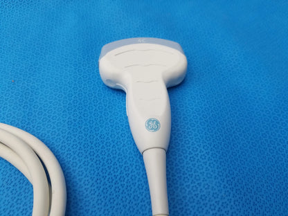 White ge ultrasound convex array transducer probe with ergonomic design and coiled cable for ultrasound imaging compatibility