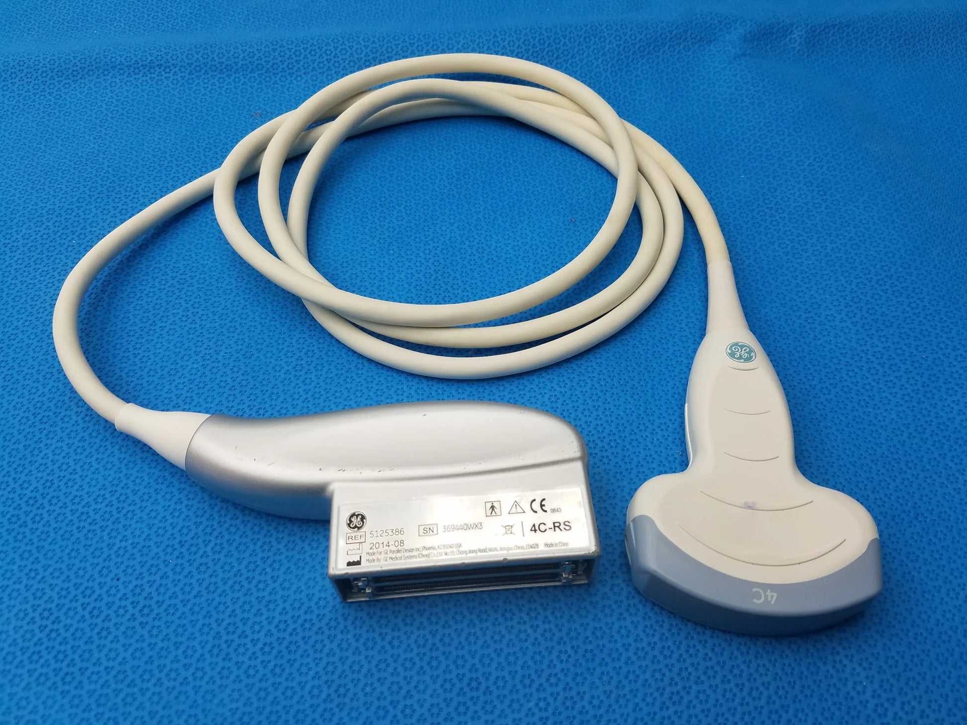 Silver and gray ge medical systems 4c-rs ultrasound convex array transducer with coiled cable for ultrasound imaging