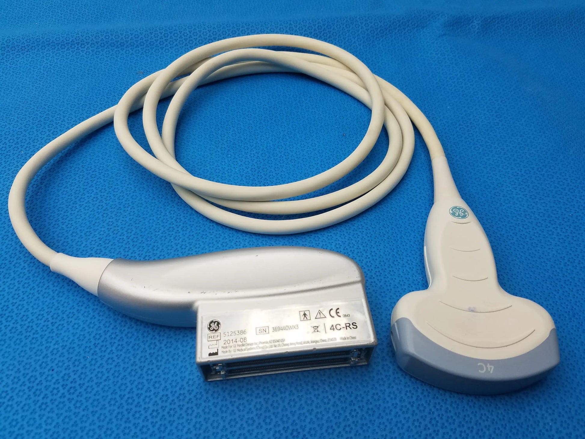 Ge medical systems 4c-rs ultrasound convex array transducer probe in silver and gray with coiled white cable for ultrasound imaging compatible ge ultrasound