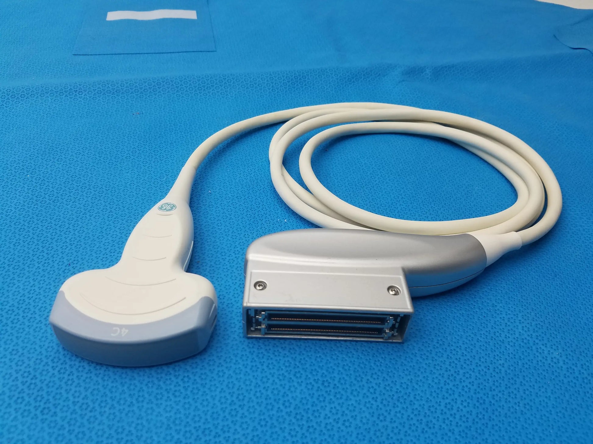 Ge medical systems 4c-rs ultrasound convex array transducer probe in white and gray with coiled cable for ultrasound imaging compatible ge ultrasound