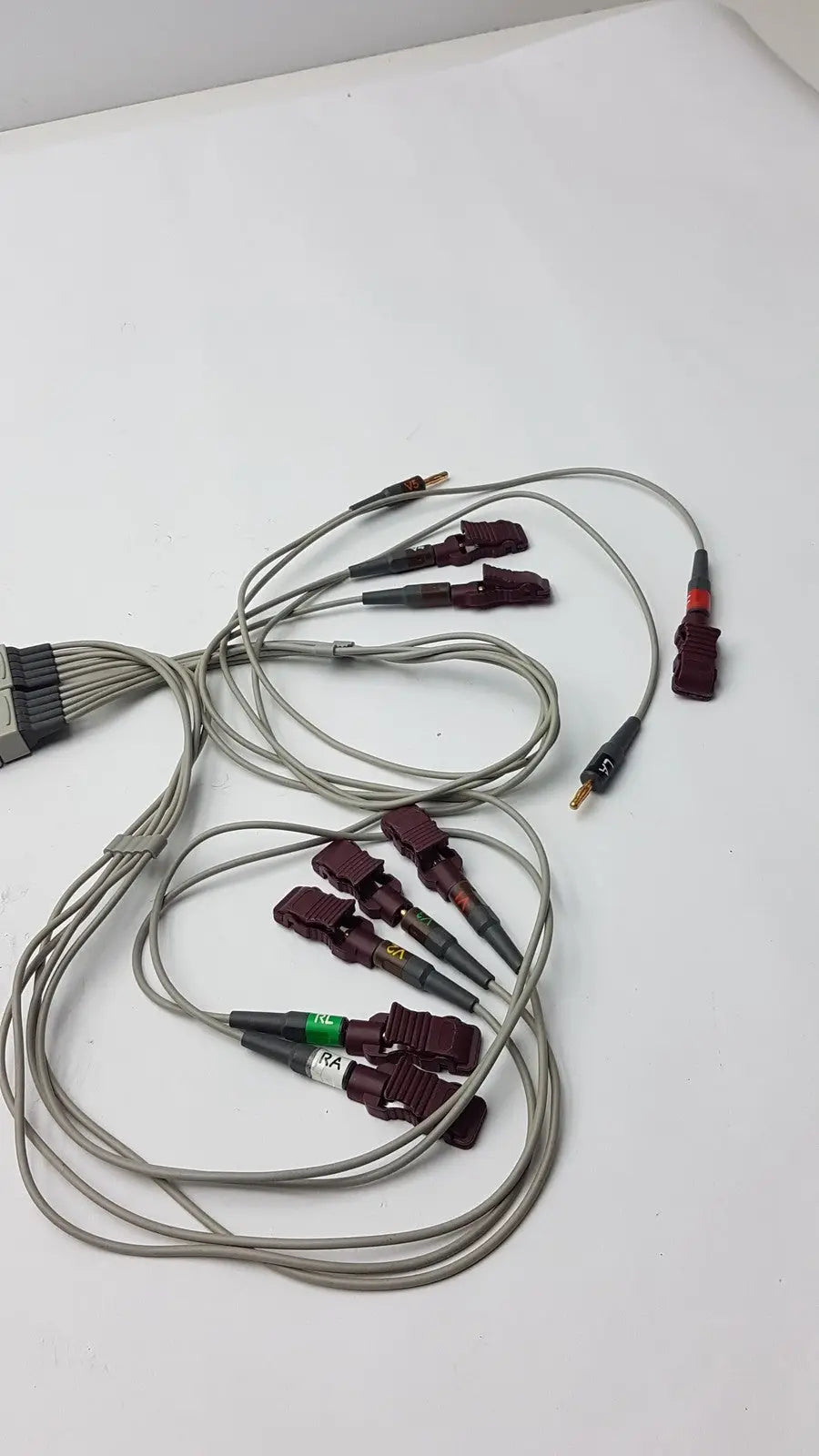 A set of medical systems multi-link cable ecg lead cables with gray insulated wires and maroon plastic connectors