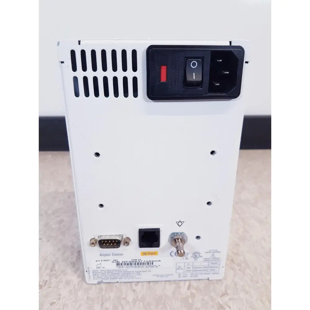 White axys comm power supply unit with black control panel red switch and ports on the back of ge prn 50-m thermal medical digital printer