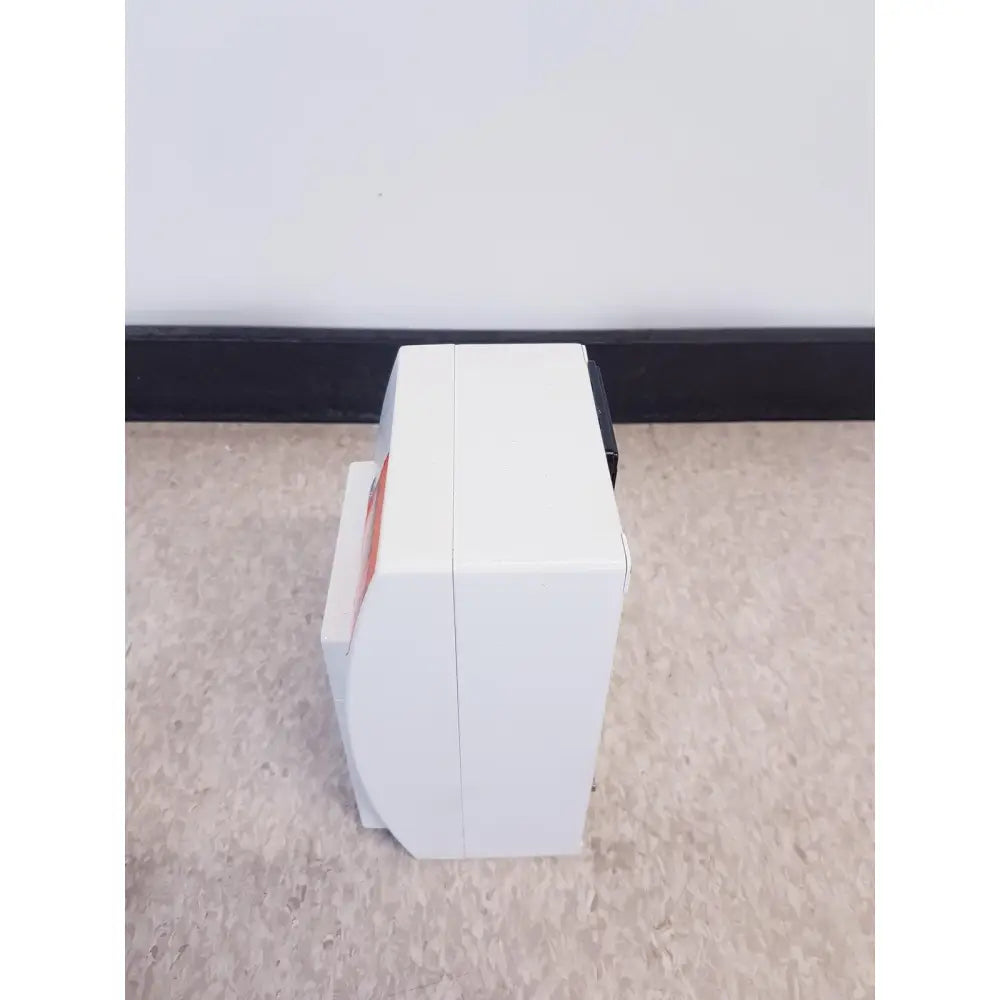 White rectangular GE prn 50-m thermal medical digital printer with curved front edge and orange side label as-is condition