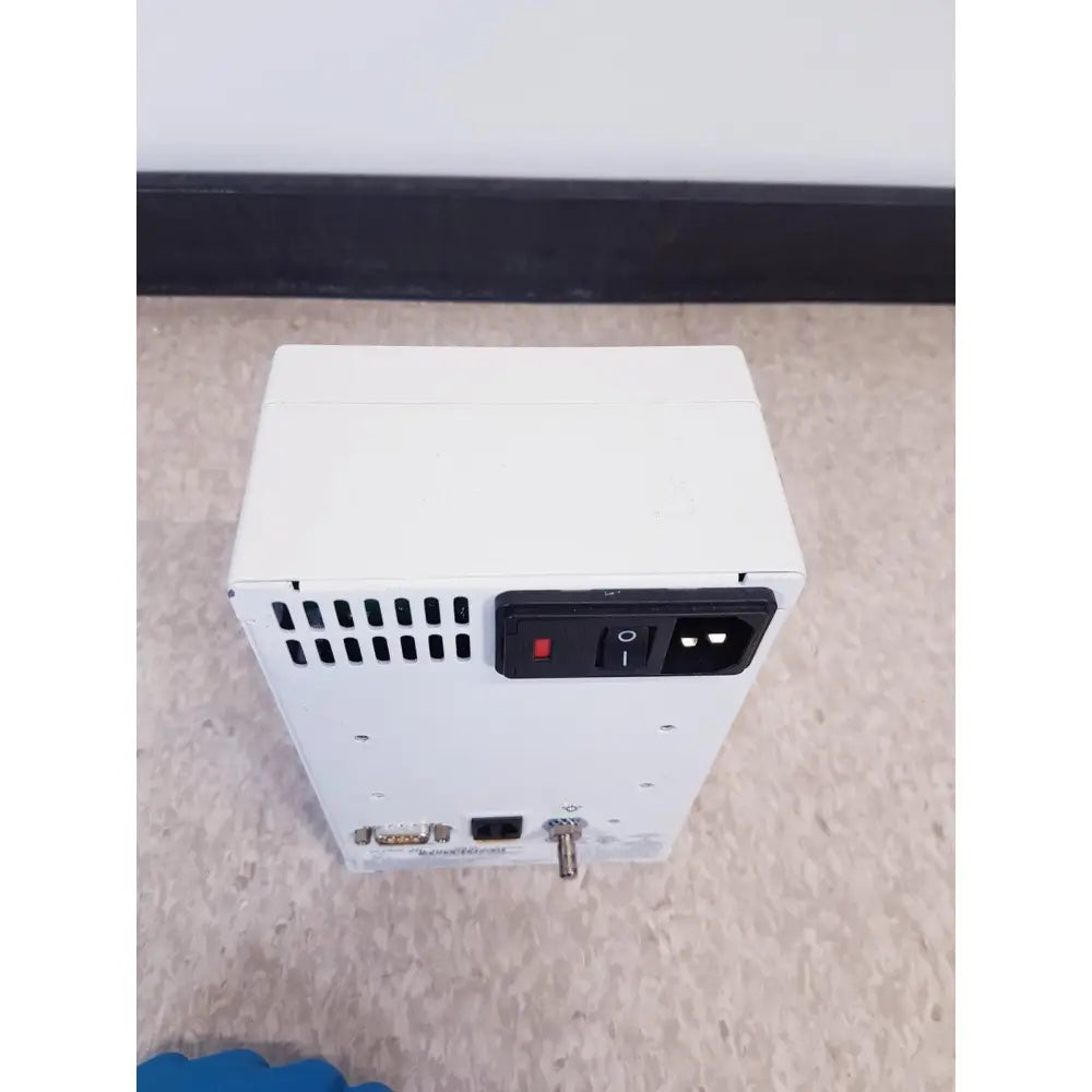 Back side of white rectangular power supply unit with black switch and ac input port for ge prn 50-m medical digital printer