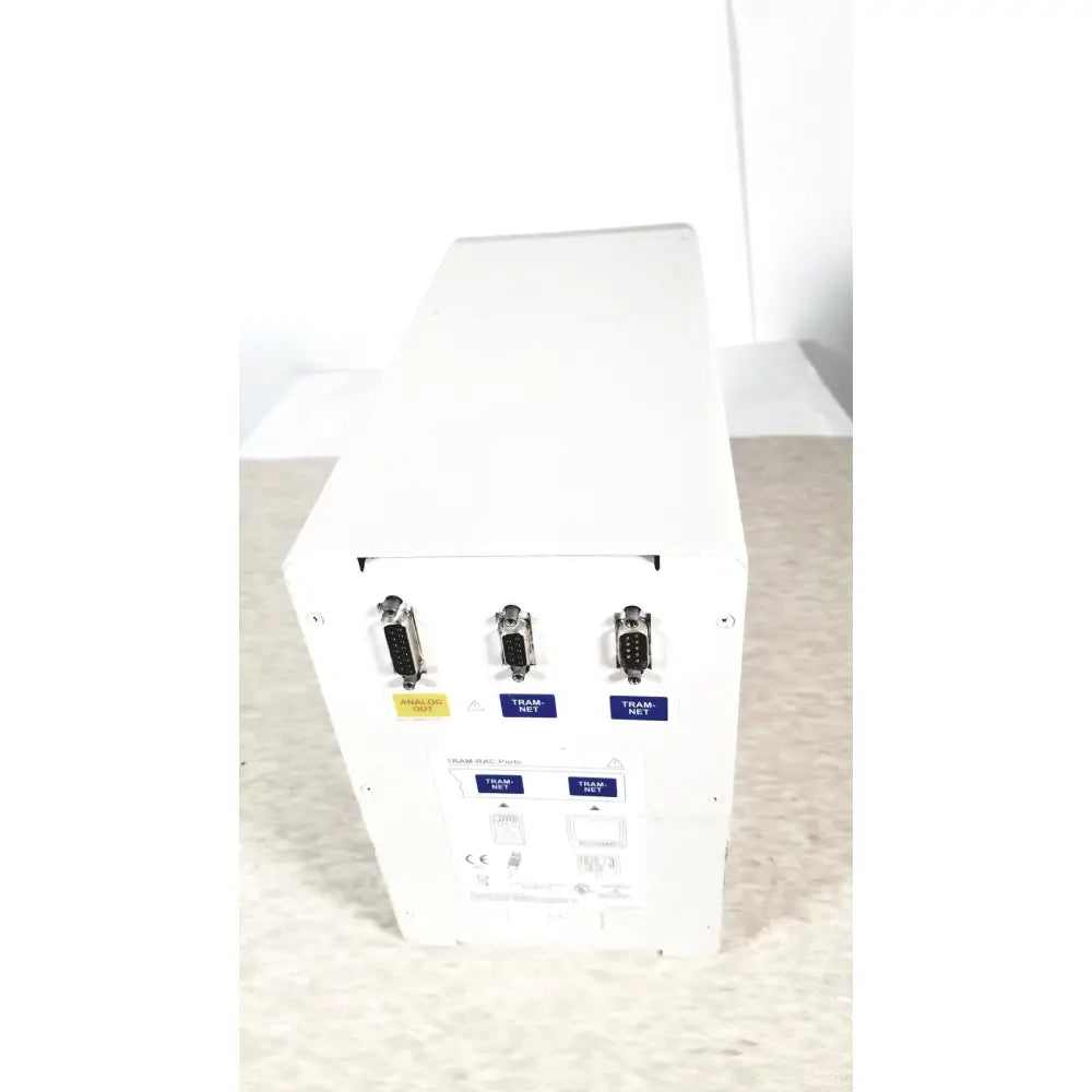 Back view of white matte finish ge tram-rac 4a module rack with three db-9 analog out and two tram-net serial ports