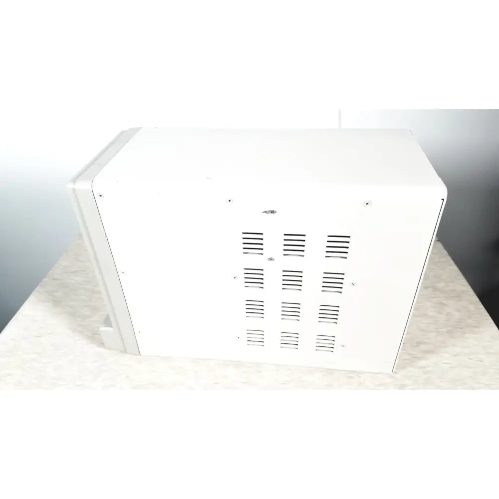 White rectangular GE tram-rac 4a module rack with horizontal ventilation slits for reuse medical equipment