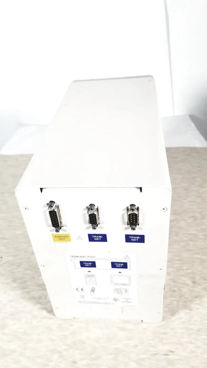Back view of white matte finish ge tram-rac 4a module rack with three db-9 analog out and two tram-net serial ports