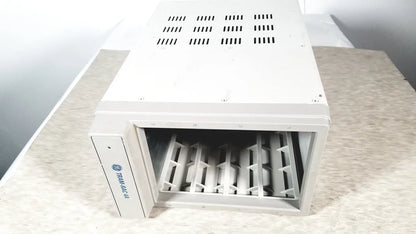 White rectangular hvac vent with slotted grid and metal grilles for cooling in GE TRAM-RAC 4A module rack reuse medical setup