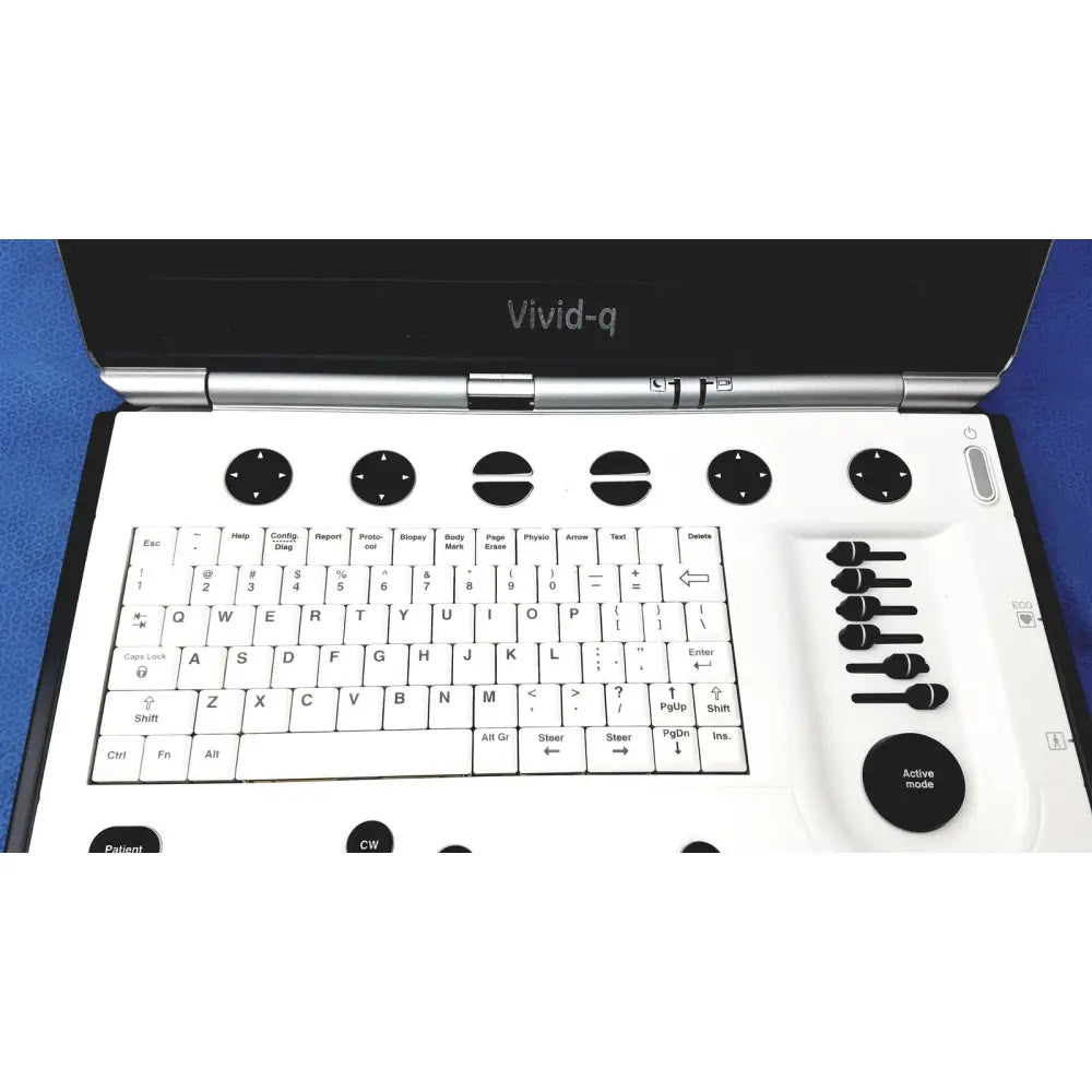 White vivid portable ultrasound machine keyboard with black keys and circular control dials branded vivid-q