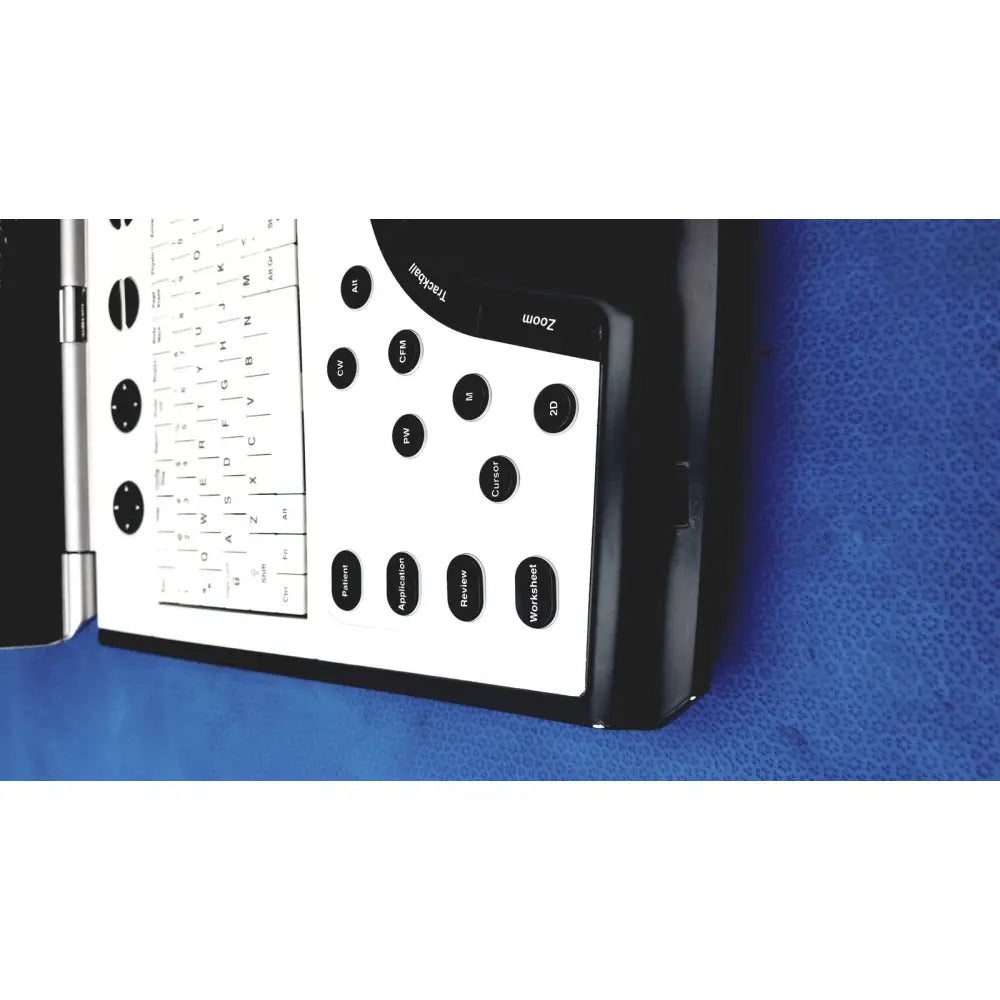 Black and white vivid portable ultrasound machine with built-in keyboard labeled trackall on its side