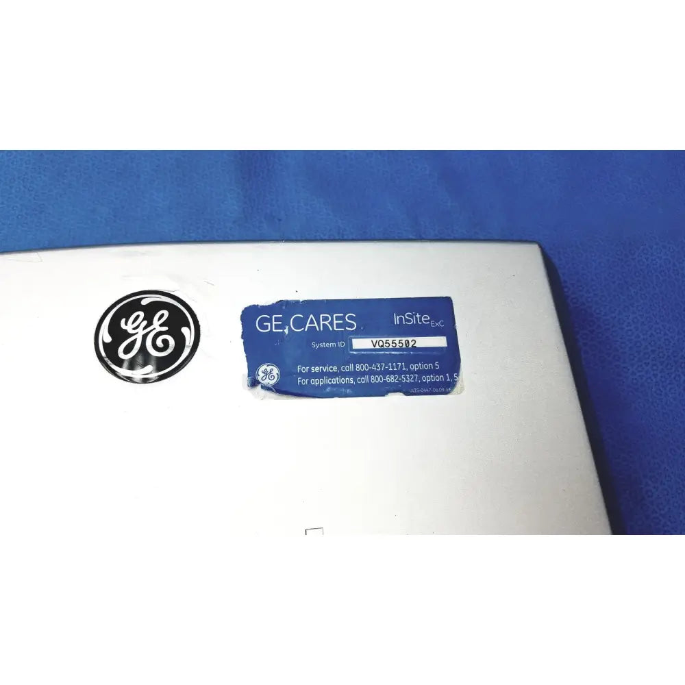 White ge insite emc vivid portable ultrasound machine with blue label and black circular logo for medical use