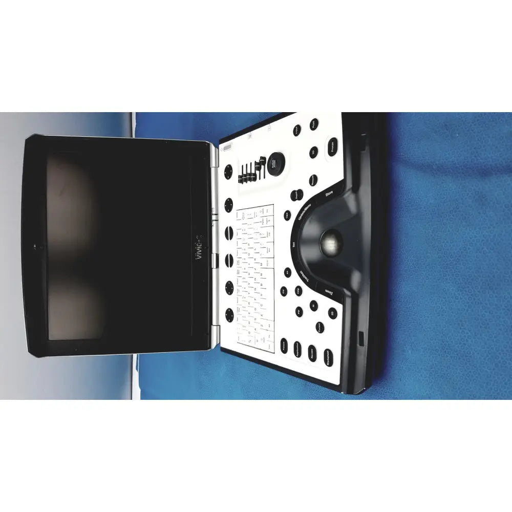 Black and white GE vivid portable ultrasound machine with integrated keyboard and compact portable ultrasound machine design