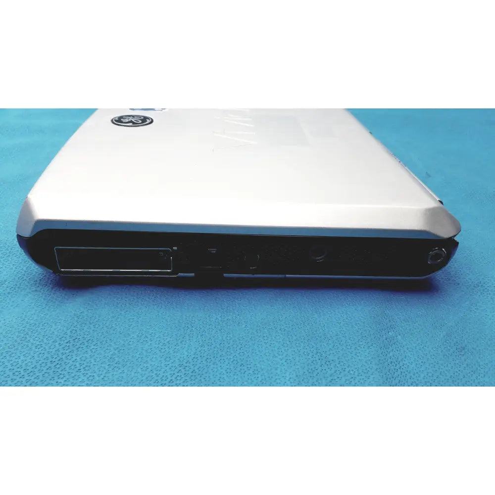 White GE vivid portable ultrasound machine with sleek metallic finish and black ports along the side of the laptop