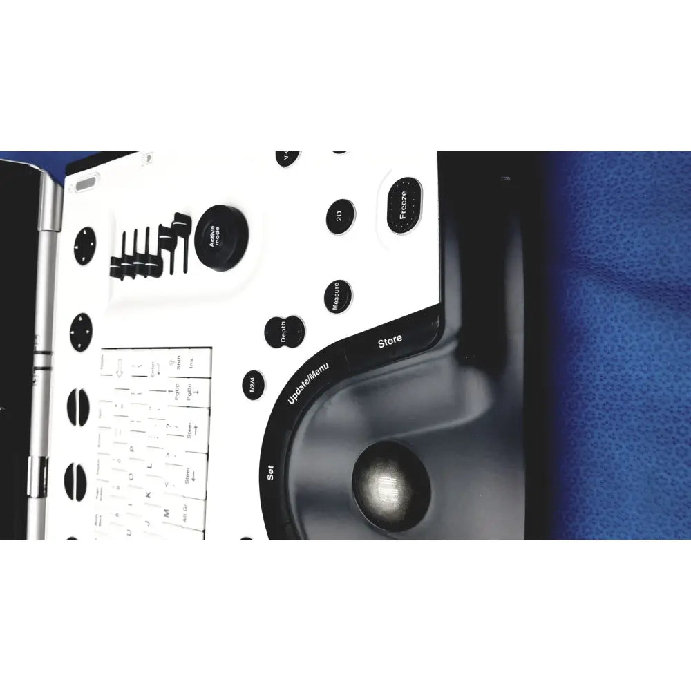 White and black handheld 3d scanner with circular trackball and labeled buttons on vivid portable ultrasound machine