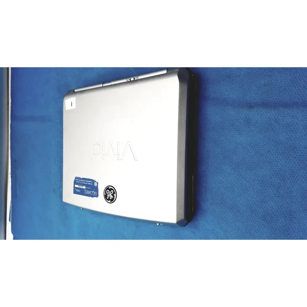 Silver-colored sony vaio laptop with sleek metallic finish and black trim alongside vivid portable ultrasound machine