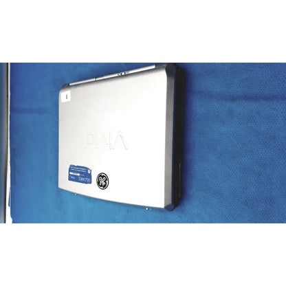 Silver-colored sony vaio laptop with sleek metallic finish and black trim alongside vivid portable ultrasound machine