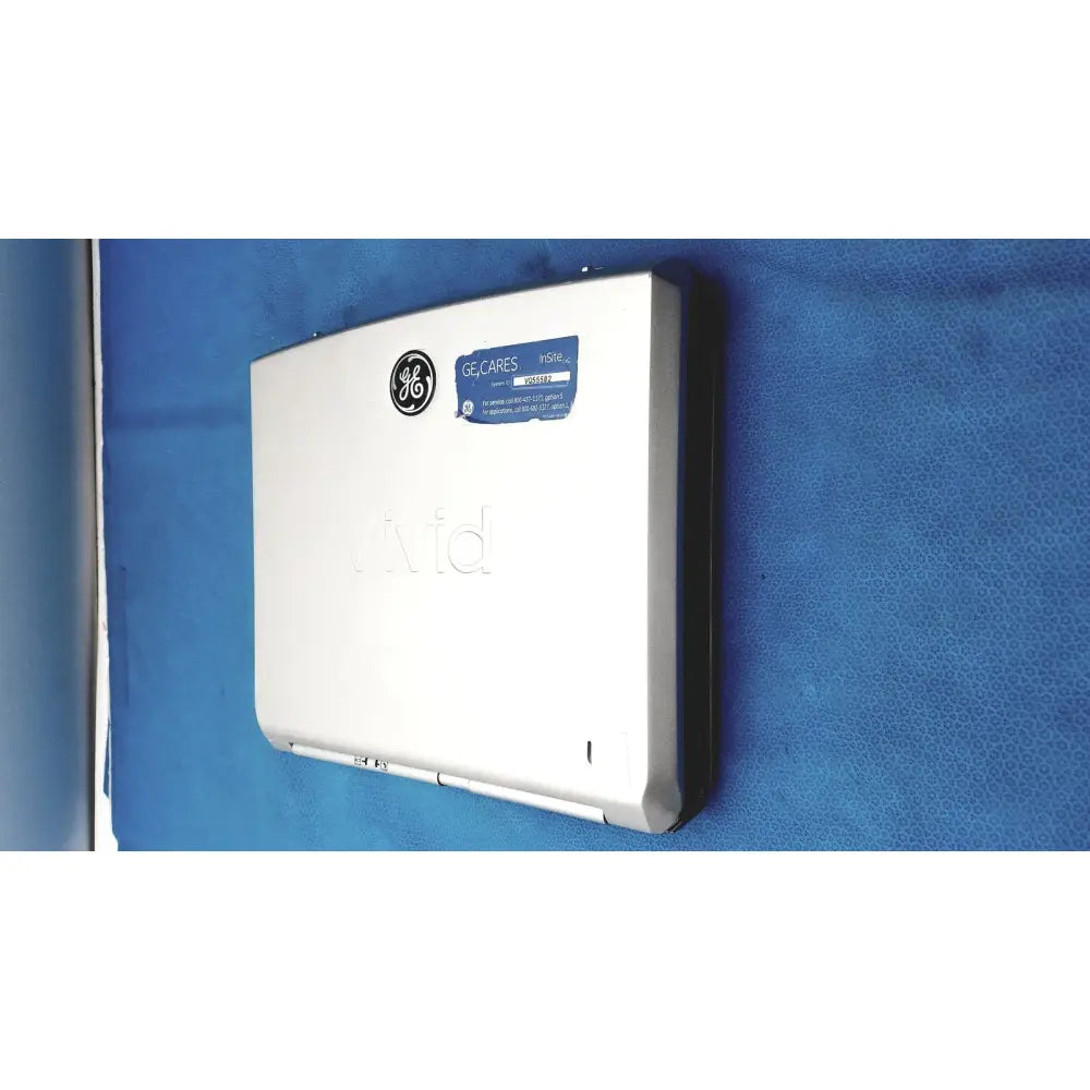 White ge-branded wall-mounted air conditioner with blue gelcares sticker featured with vivid portable ultrasound machine