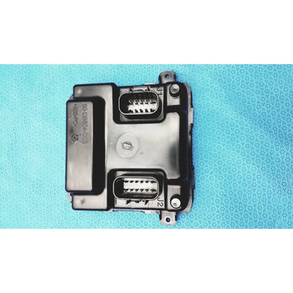 Black plastic gem driver display control module with two rectangular connector ports and circular screw fastener back side