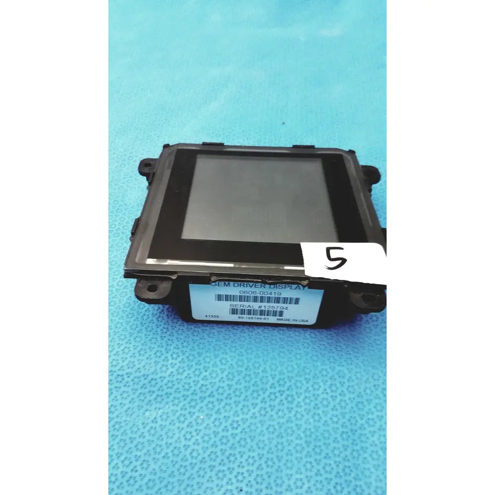 Black plastic gem driver display 0606-00419 with rectangular screen and mounting brackets for vehicle use