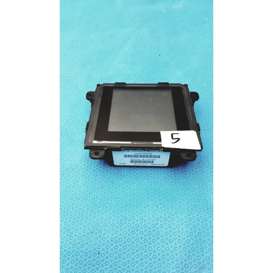 Black plastic gem driver display module with rectangular screen and mounting brackets for vehicle use serial 125794