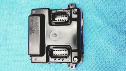 Black plastic gem driver display control module with two rectangular connector ports and circular screw fastener back side